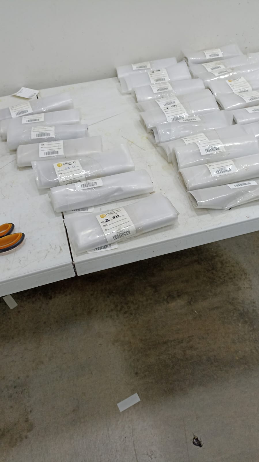 Several plastic bags on a table
Description automatically generated